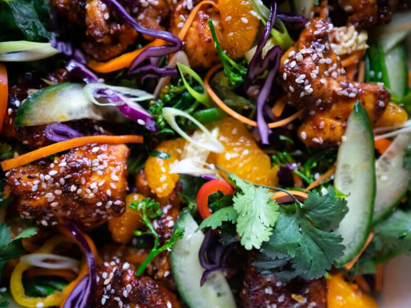 Salt and Pepper chicken and mandarin with salad close up