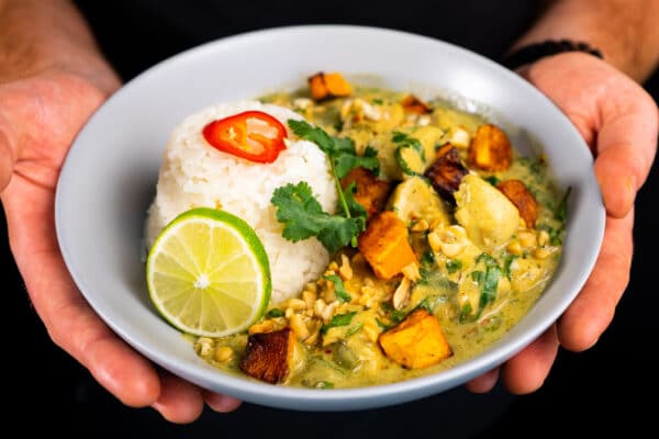 Squash, Chicken and Nut curry in a bowl with rice